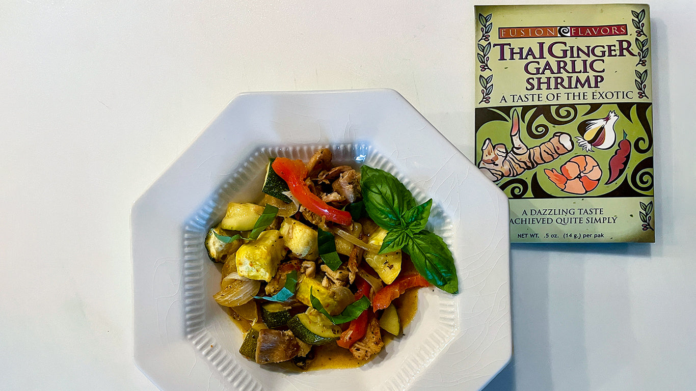 picture of a bowl of curry with colorful vegetables and packet of Thai Garlic Ginger Shrimp seasoning packet